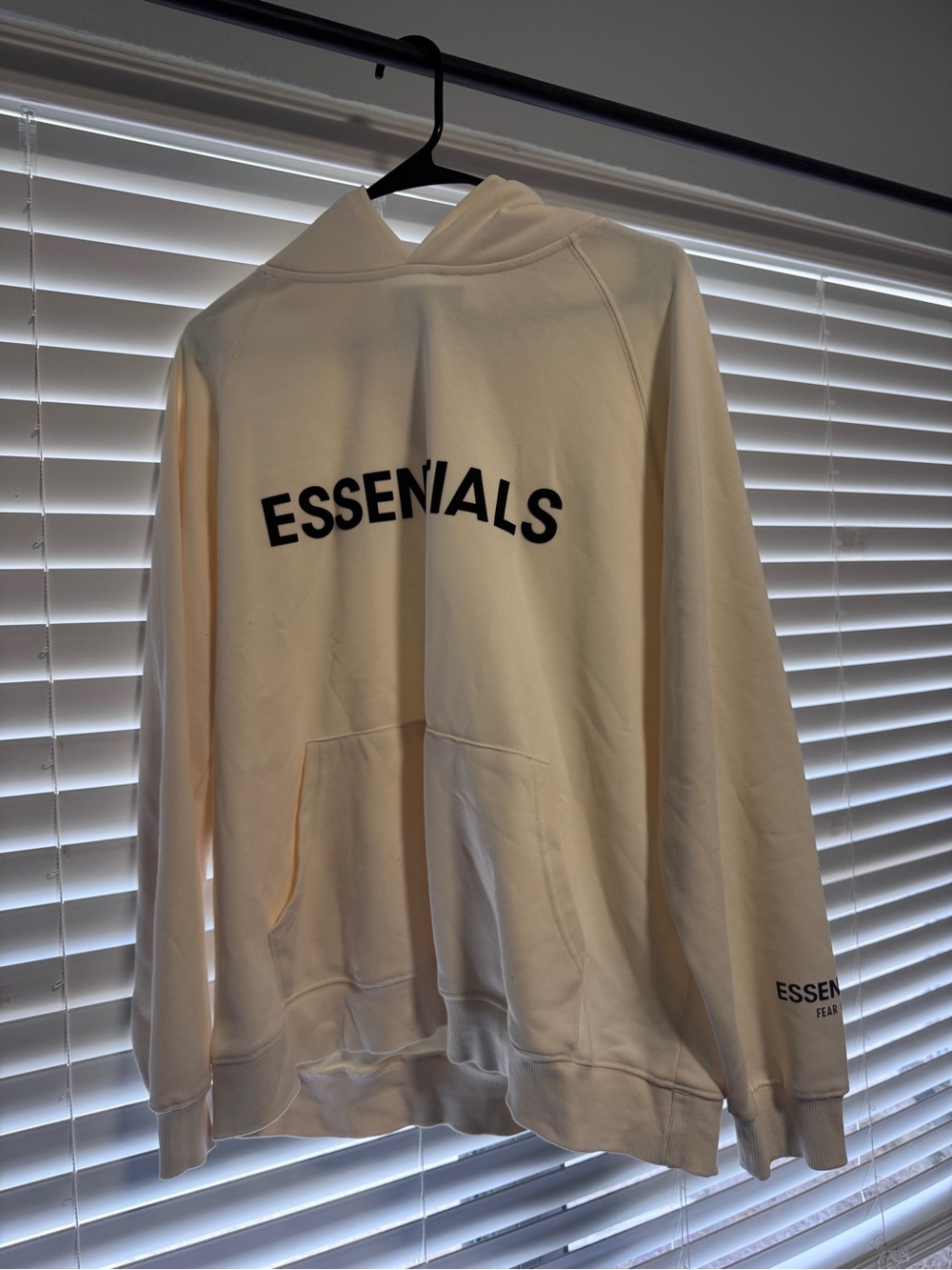 Fear of God ESSENTIALS Cream Sweatshirt with Black Logo